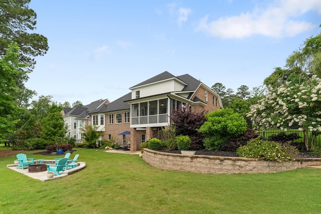 460 Armstrong Way, Evans, GA 30809 - back of house featuring an outdoor fire pit, brick siding, a sunroom, and a yard