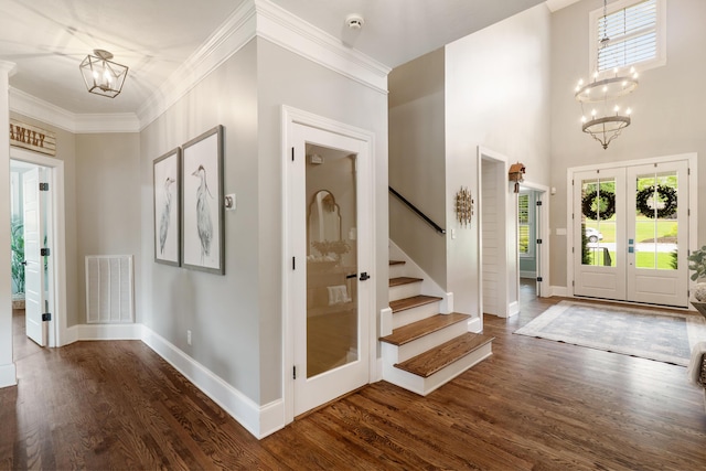 460 Armstrong Way, Evans, GA 30809 - foyer entrance featuring a chandelier, dark wood finished floors, french doors, stairway, and crown molding