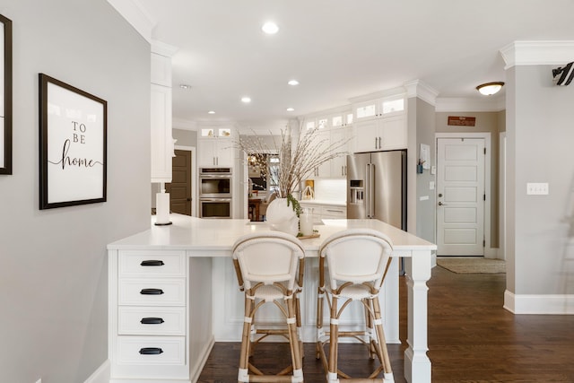 460 Armstrong Way, Evans, GA 30809 - kitchen with appliances with stainless steel finishes, a peninsula, glass insert cabinets, recessed lighting, and light countertops