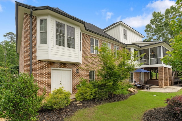 460 Armstrong Way, Evans, GA 30809 - back of property featuring a patio area, brick siding, a sunroom, and a lawn