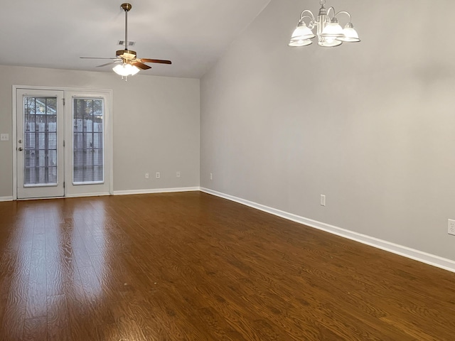 unfurnished room with ceiling fan with notable chandelier, visible vents, baseboards, and dark wood-type flooring