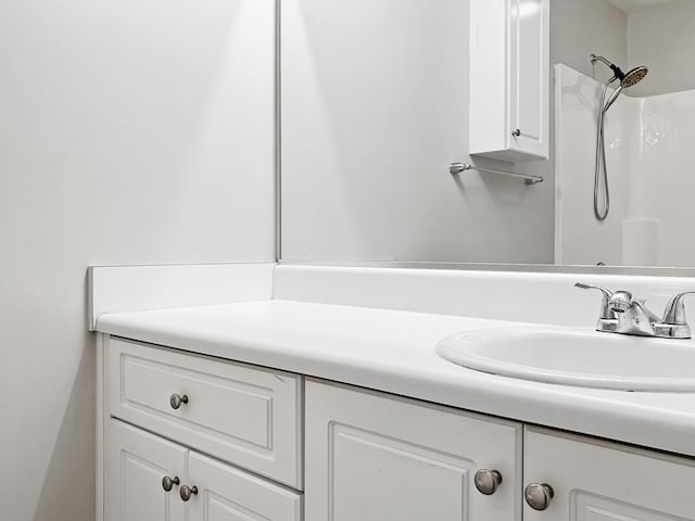 full bathroom with vanity and walk in shower