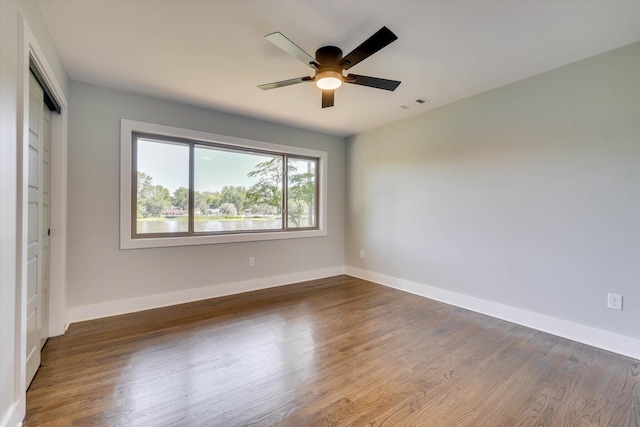 118 Lake Bluff Dr, Waynesboro, GA 30830 - unfurnished bedroom with wood finished floors, a closet, and ceiling fan
