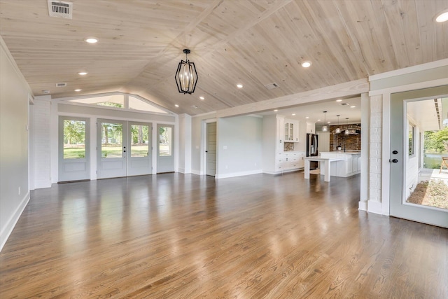 118 Lake Bluff Dr, Waynesboro, GA 30830 - unfurnished living room featuring french doors, plenty of natural light, vaulted ceiling, wood finished floors, and wood ceiling