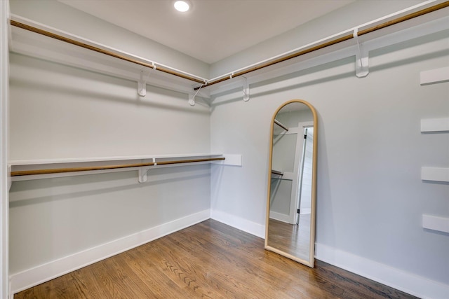 118 Lake Bluff Dr, Waynesboro, GA 30830 - spacious closet featuring wood finished floors and arched walkways