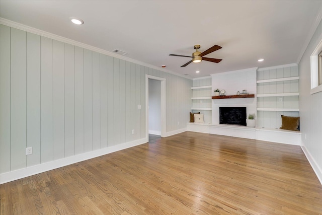 118 Lake Bluff Dr, Waynesboro, GA 30830 - unfurnished living room with ornamental molding, wood finished floors, a ceiling fan, a fireplace, and recessed lighting