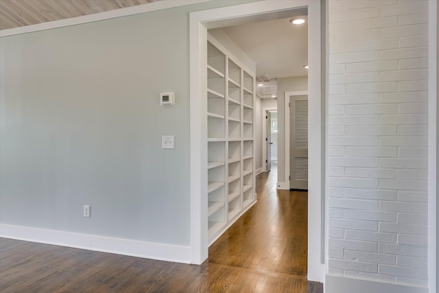 118 Lake Bluff Dr, Waynesboro, GA 30830 - corridor with dark wood finished floors and built in shelves