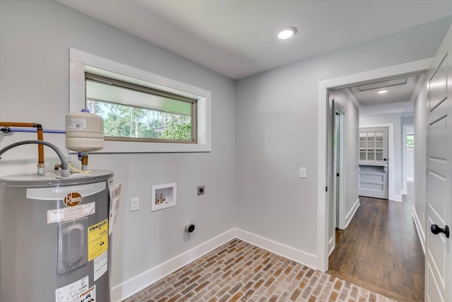 118 Lake Bluff Dr, Waynesboro, GA 30830 - washroom with water heater, electric dryer hookup, washer hookup, and attic access