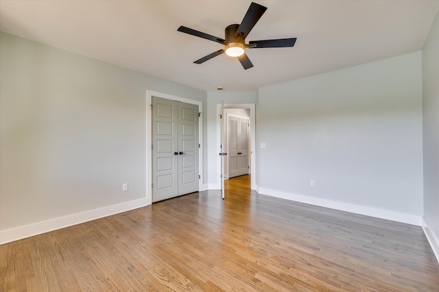 118 Lake Bluff Dr, Waynesboro, GA 30830 - unfurnished bedroom with light wood-style flooring and a ceiling fan