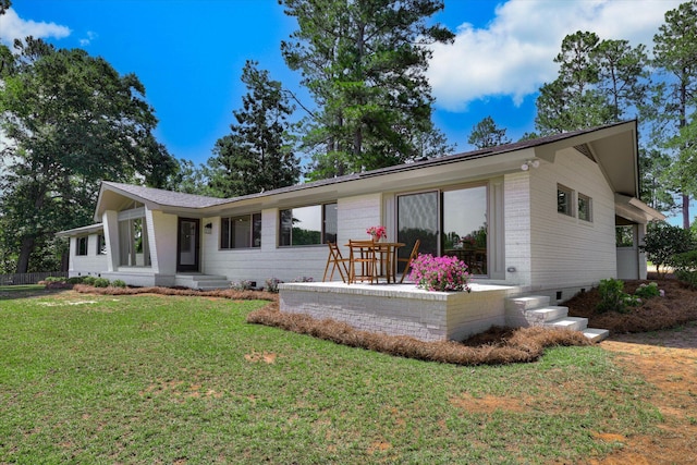 118 Lake Bluff Dr, Waynesboro, GA 30830 - view of front facade featuring a front lawn and brick siding