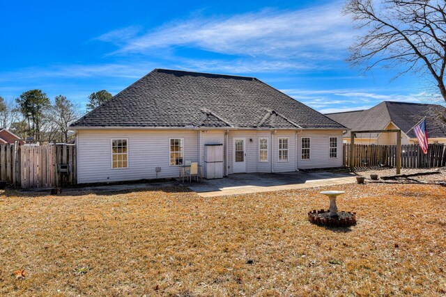 back of property with a patio