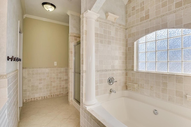 bathroom featuring ornamental molding, separate shower and tub, tile walls, and tile patterned floors