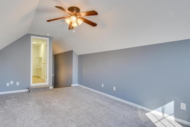 additional living space with vaulted ceiling, ceiling fan, and carpet flooring