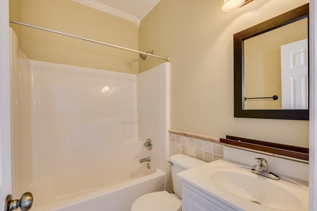 full bathroom with  shower combination, tile walls, vanity, ornamental molding, and toilet