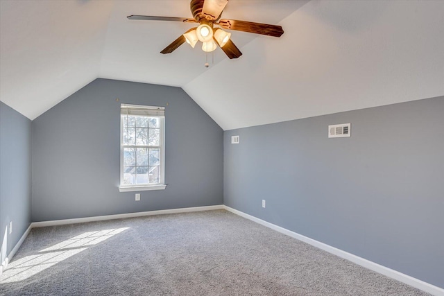 additional living space featuring lofted ceiling, carpet flooring, and ceiling fan