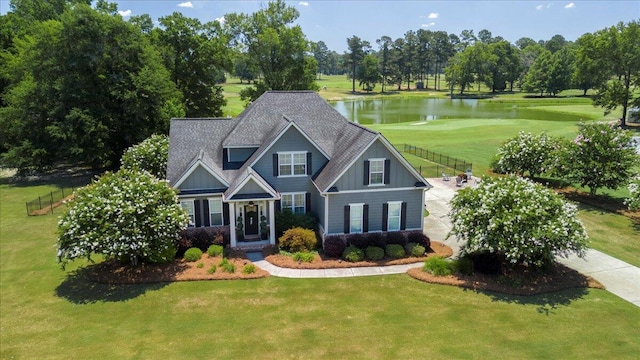 245 Shady Oak Ln, Waynesboro, GA 30830 - craftsman-style house featuring a front lawn, view of golf course, a water view, board and batten siding, and fence