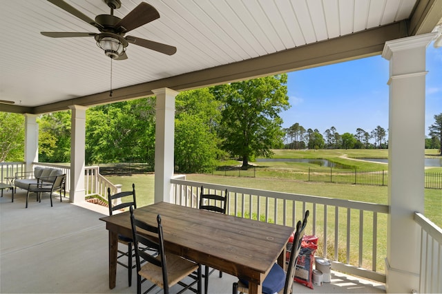 245 Shady Oak Ln, Waynesboro, GA 30830 - view of patio / terrace with outdoor dining area, a water view, and fence