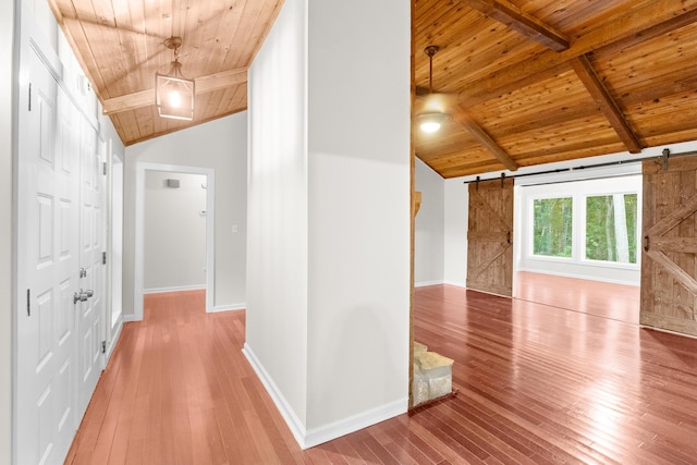 354 Rice Ct, Martinez, GA 30907 - hallway with wood ceiling, a barn door, and hardwood / wood-style floors