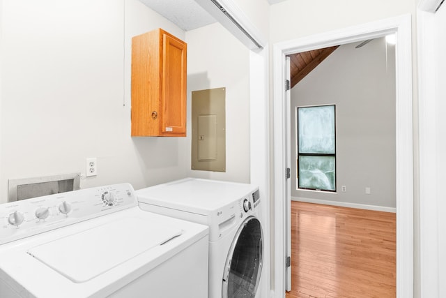 354 Rice Ct, Martinez, GA 30907 - laundry room with cabinet space, electric panel, light wood-style flooring, and washing machine and dryer