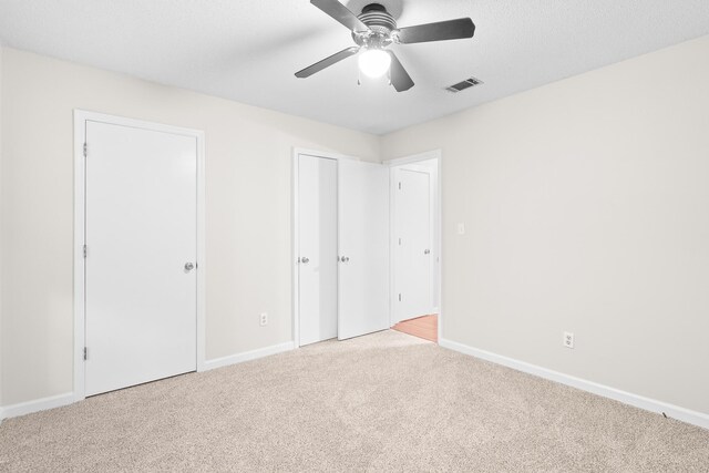 354 Rice Ct, Martinez, GA 30907 - unfurnished bedroom with carpet, ceiling fan, and multiple closets