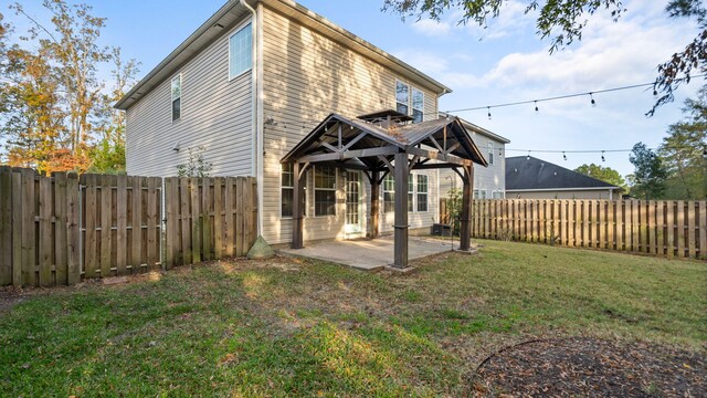 back of property featuring a yard and a patio