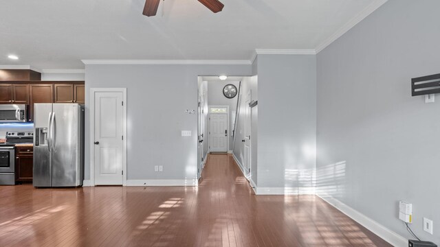 unfurnished living room with hardwood / wood-style floors, ceiling fan, and ornamental molding