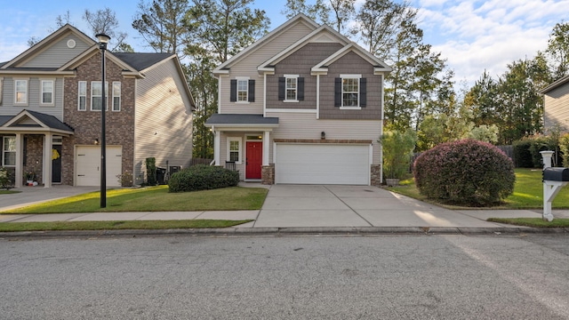 view of front of property with a front yard and a garage