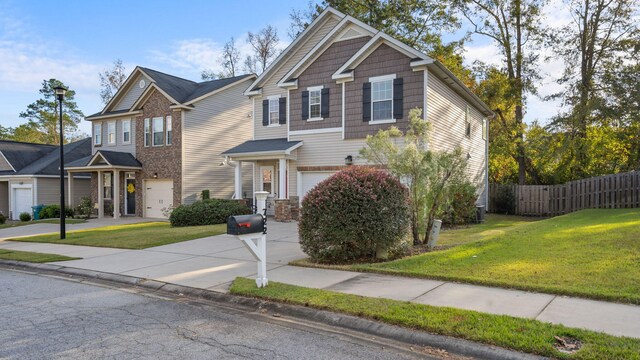 view of front of house featuring a garage and a front lawn