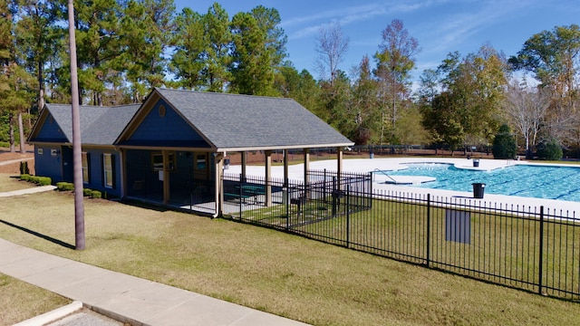 view of swimming pool with a lawn and a patio area