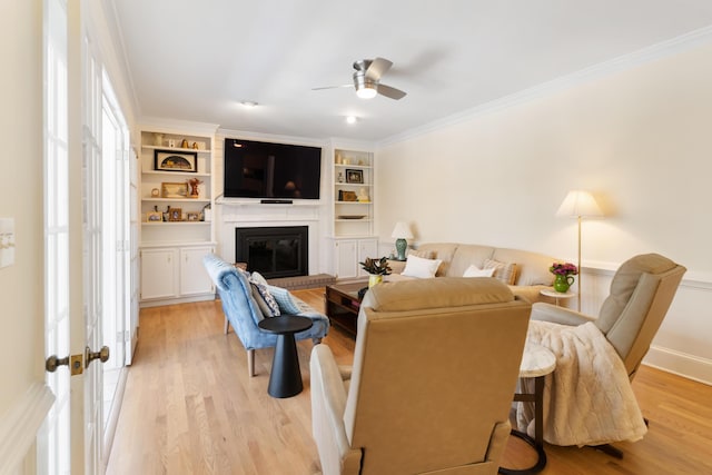 3503 Preston Trl, Martinez, GA 30907 - living area featuring ceiling fan, a fireplace, light wood-style floors, built in features, and ornamental molding