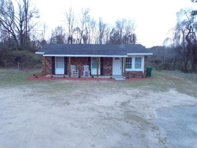 ranch-style house with covered porch