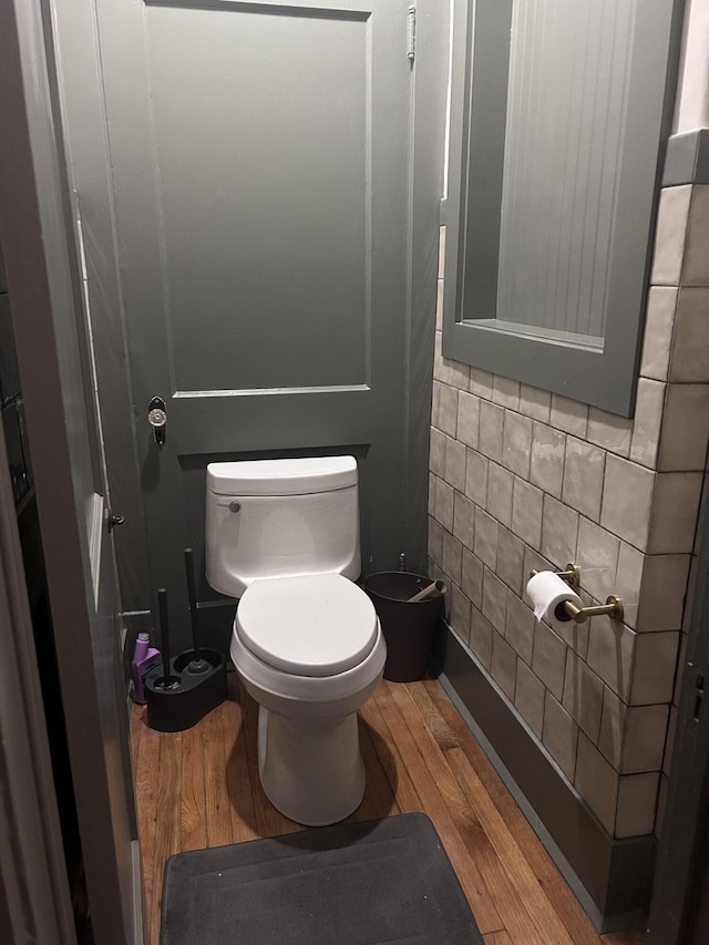 118 Humphrey St, Lincolnton, GA 30817 - bathroom with wood finished floors, toilet, and tile walls