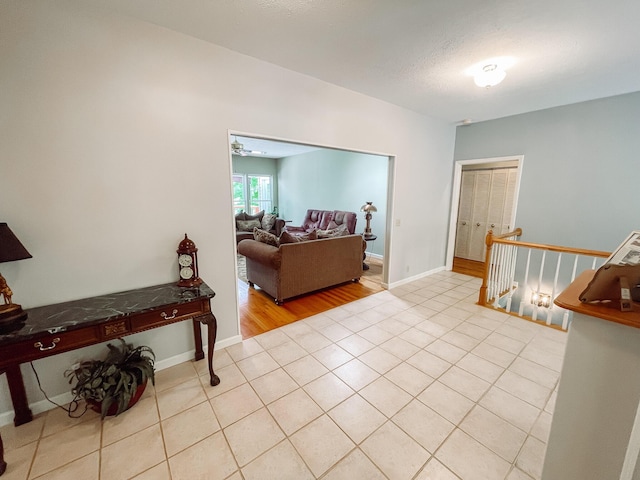 interior space with baseboards and tile patterned flooring