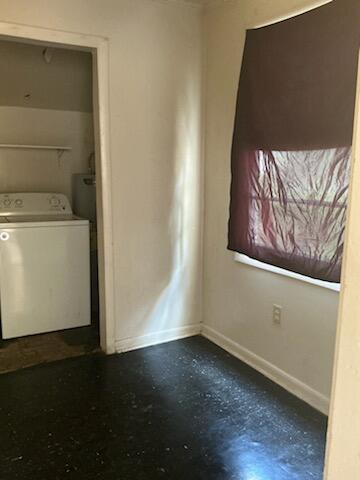 1618 Princeton Ln, Augusta, GA 30904 - empty room featuring washer / clothes dryer, baseboards, and concrete flooring