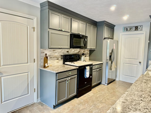 kitchen featuring gray cabinets, light stone counters, stainless steel fridge with ice dispenser, and range with electric cooktop