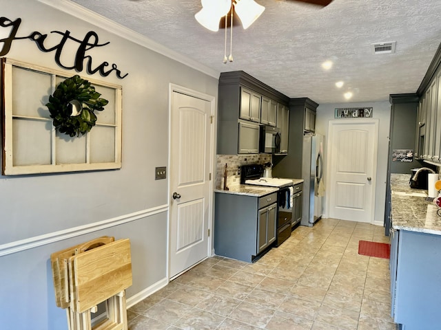 kitchen featuring light stone countertops, crown molding, a textured ceiling, gray cabinets, and black appliances