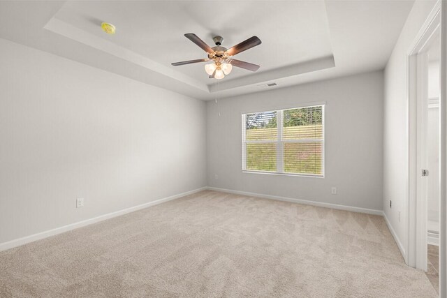 2885 Saltwater Bnd, Beech Island, SC 29842 - unfurnished room with a ceiling fan, visible vents, light colored carpet, baseboards, and a tray ceiling