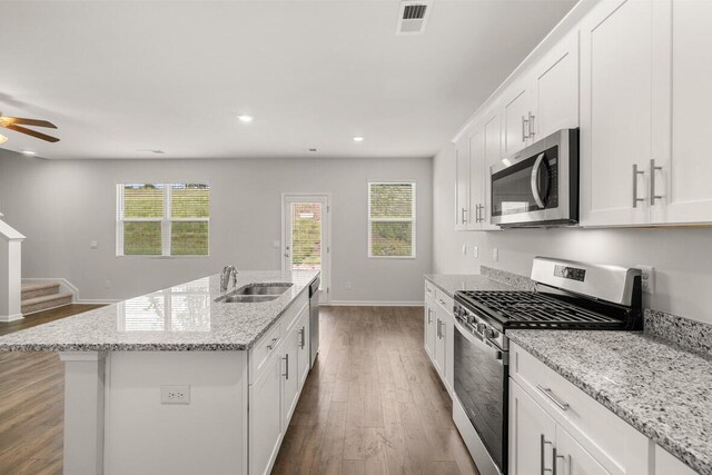 2885 Saltwater Bnd, Beech Island, SC 29842 - kitchen featuring a kitchen island with sink, white cabinetry, a sink, dark wood finished floors, and stainless steel appliances