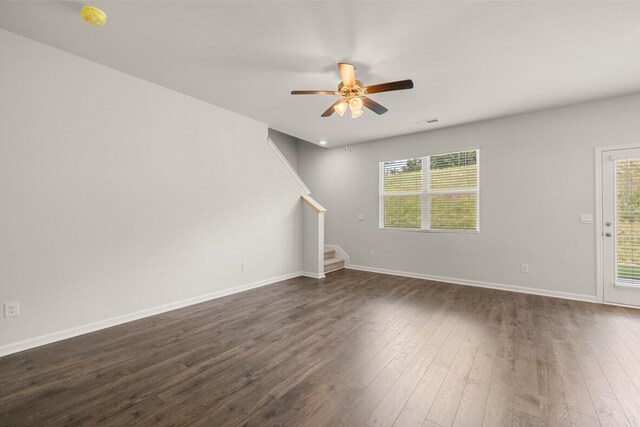 2885 Saltwater Bnd, Beech Island, SC 29842 - unfurnished living room featuring stairway, a ceiling fan, dark wood finished floors, and a wealth of natural light