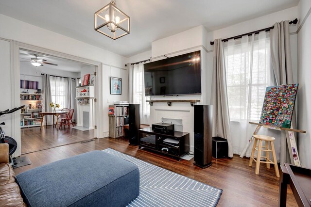 1544 Schley St, Augusta, GA 30904 - living area featuring wood finished floors, ceiling fan, and a chandelier