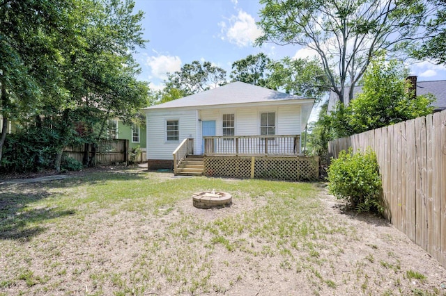 1544 Schley St, Augusta, GA 30904 - rear view of property with an outdoor fire pit and a wooden deck