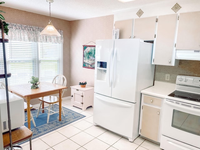 kitchen featuring extractor fan, white cabinets, decorative light fixtures, and white appliances