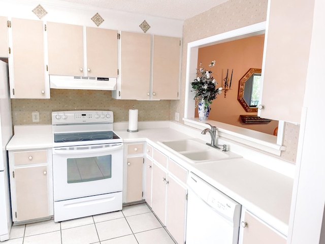 317 Coastal Cv, Mccormick, SC 29835 - kitchen with white cabinetry, sink, light tile patterned floors, and white appliances