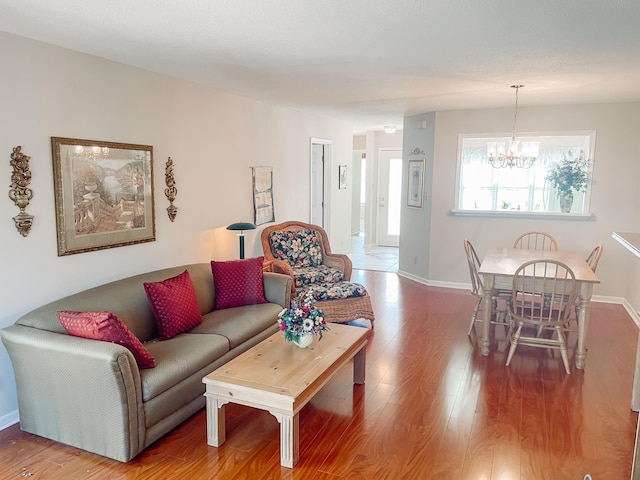 317 Coastal Cv, Mccormick, SC 29835 - living room featuring hardwood / wood-style flooring and a notable chandelier