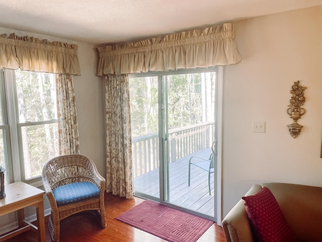 317 Coastal Cv, Mccormick, SC 29835 - doorway to outside featuring a textured ceiling and hardwood / wood-style flooring