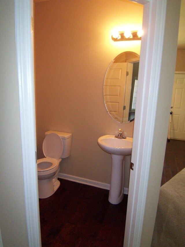 2103 Kaneck Way, Hephzibah, GA 30815 - half bath featuring toilet, baseboards, and wood finished floors