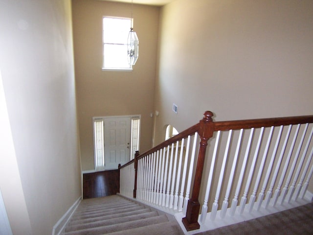 2103 Kaneck Way, Hephzibah, GA 30815 - stairs with carpet floors, a high ceiling, and a chandelier