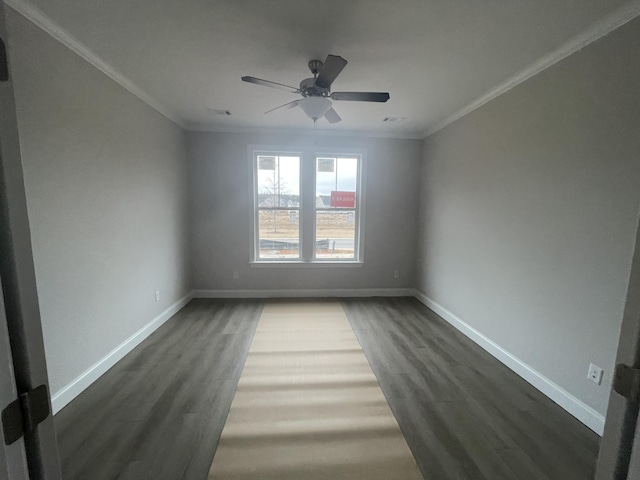 unfurnished room featuring crown molding, dark hardwood / wood-style flooring, and ceiling fan