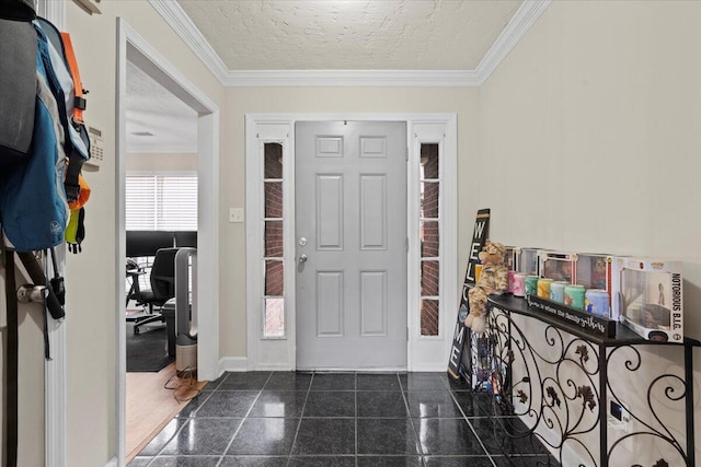 entryway with a textured ceiling and crown molding