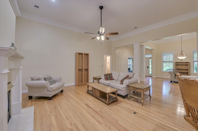 972 Woody Hill Cir, Evans, GA 30809 - living area with light wood-type flooring, ornate columns, ornamental molding, ceiling fan, and baseboards